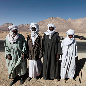 2010: Victims of radiation exposure standing outside the former test site of In Ekker, about 170 km away from the town of Tamanrasset. Radioactive material continues to seep out of the mountain, where France conducted its nuclear tests, and contaminates local soil and ground water. Photo: © Zohra Bensemra/Reuters/Corbis